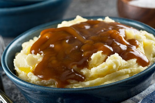 Bowl of mash with gravy on top