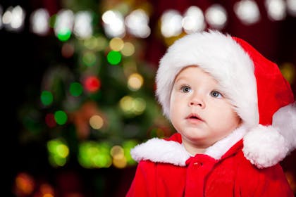 Baby wearing Santa hat