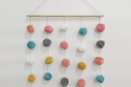 Pompom wall hanging for child bedroom