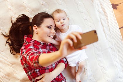 woman talking selfie with baby