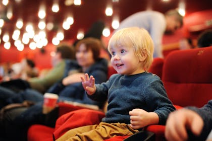 little boy at the theatre
