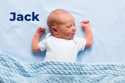 Baby lying on blue sheet with blue blanket. Name Jack written in text