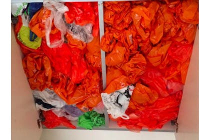 17. And a cupboard filled with plastic bags