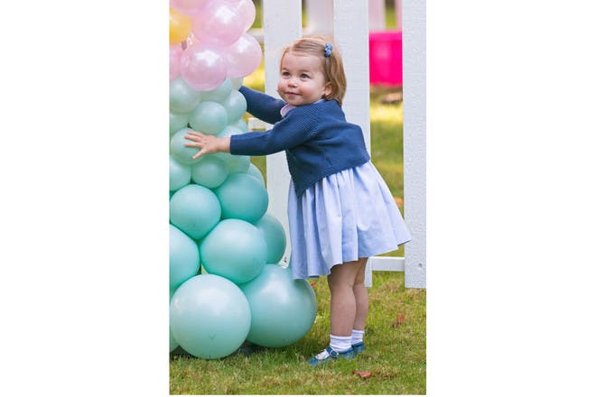 Princess Charlotte playing with balloons