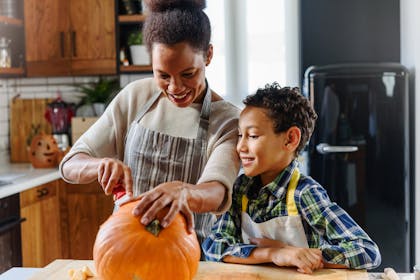 mum and son carving pumpkin