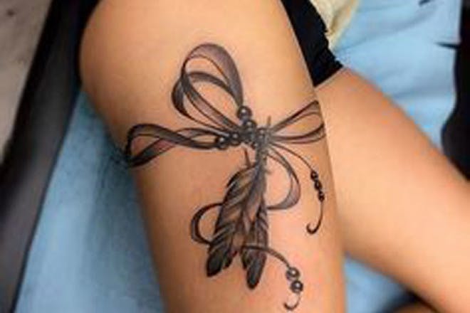 Feather bow tattoo