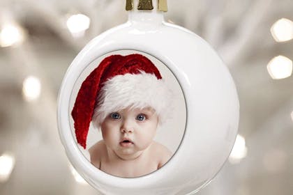 Christmas bauble with photo of baby wearing Santa hat