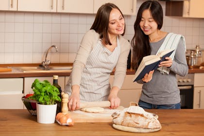 Two women cooking in kitchen