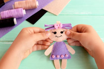 Child's hands making crafts
