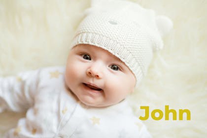 Baby wearing hat. Name John written in text