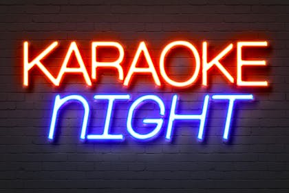 neon sign reading karaoke night