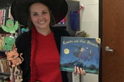 Woman wearing Room on the Broom adult costume for World Book Day