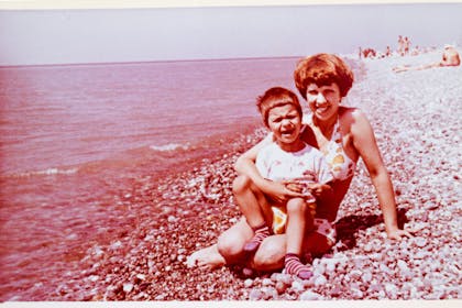 Vintage photo, mum and child on beach