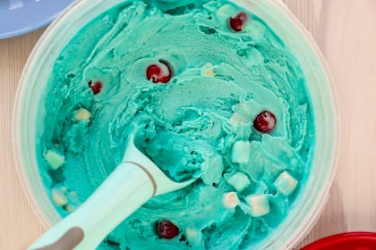 Blue sorbet with marshmallows and cranberries for party dessert