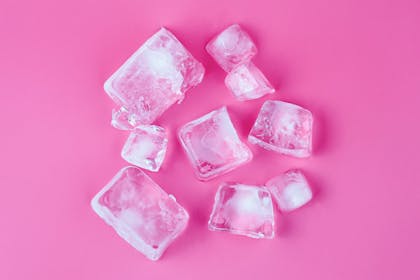 Ice cubes on a pink background