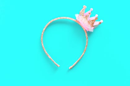 Kids' hair band with mini crown on it