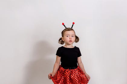 Little girl dressed in ladybird costume