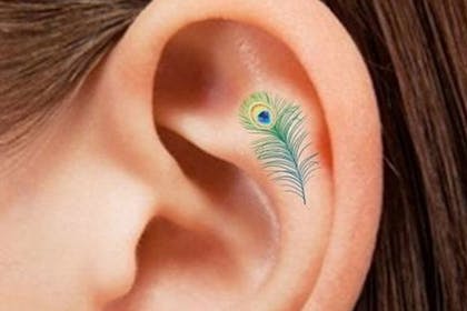Tiny feather tattoo