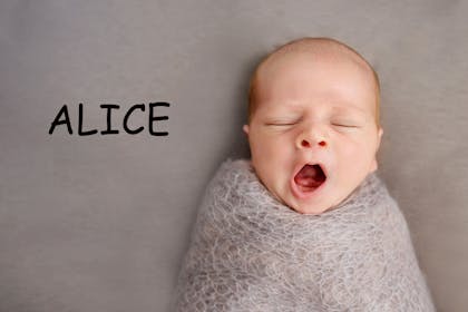 A baby sleeping with the name 'Alice' written in text