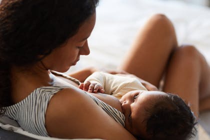 Woman breastfeeding new baby