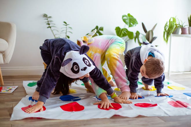 Kids playing Twister in onesies