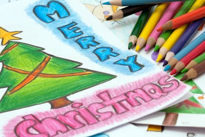 Merry Christmas written with colouring pencils
