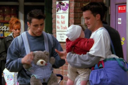 Joey and Chandler from Friends babysitting a baby
