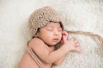 Baby sleeping with hat on