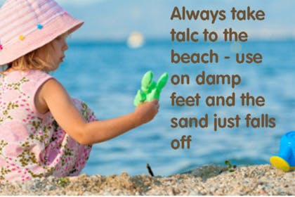 little girl playing on sandy beach