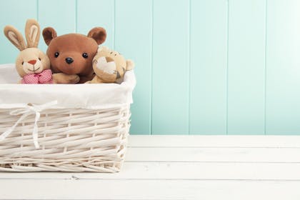 Soft baby toys in wicker basket