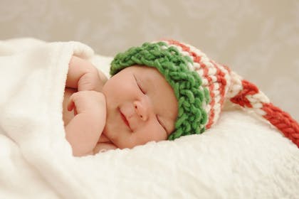 Sleeping baby with knitted Elf hat