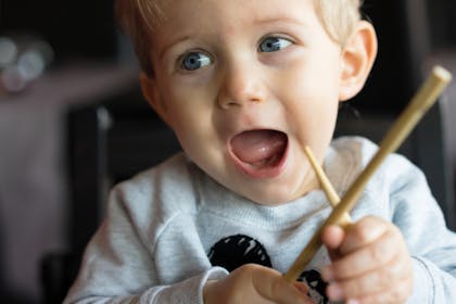 toddler with chopsticks