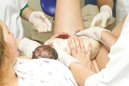 Woman giving birth