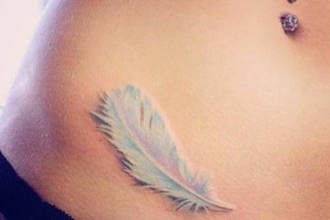 Pastel feather tattoo