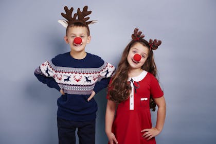 Kids wearing Rudolph noses and antlers