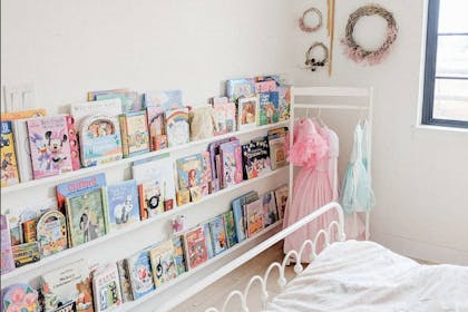 Low picture book shelves in child's bedroom