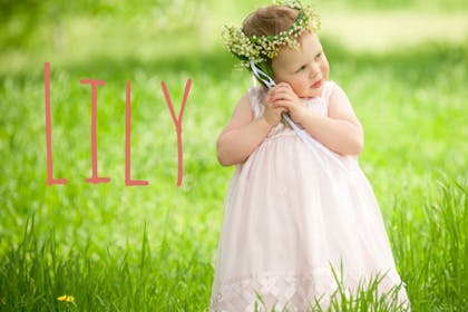 girl holding flowers - Lily baby name