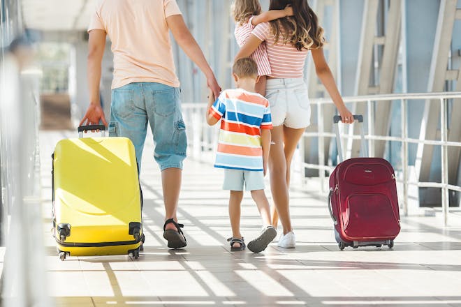 family with suitcases