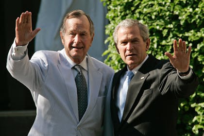 George Bush senior and George W. Bush waving together
