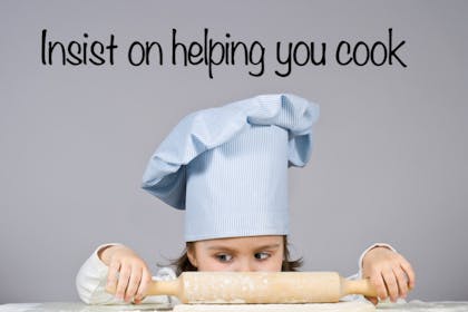 girl with chef hat and rolling pin
