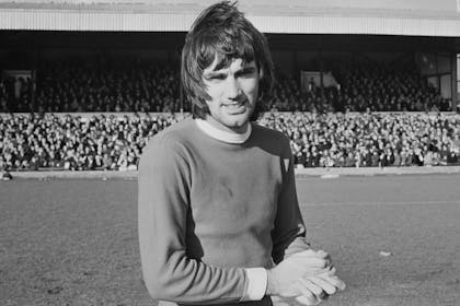 Black and white picture of George Best on football pitch in 1960s