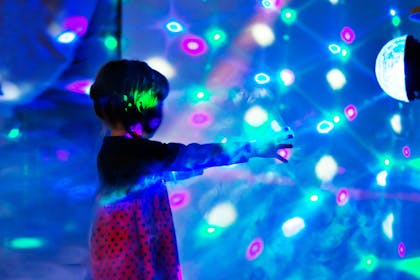 Kid dancing in disco lights