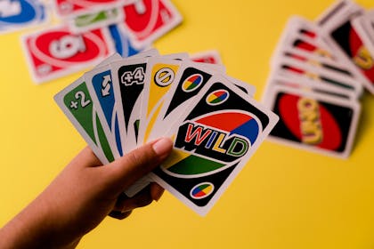 Hand holding Uno cards