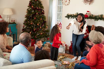 A family playing Christmas charades