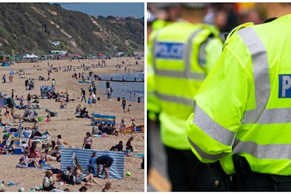 Busy beach in UK « close up of policeman in hi-vis jacket