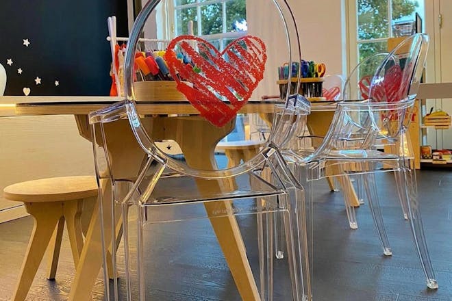 Rochelle Humes' children's playroom with a blackboard and table and chairs 