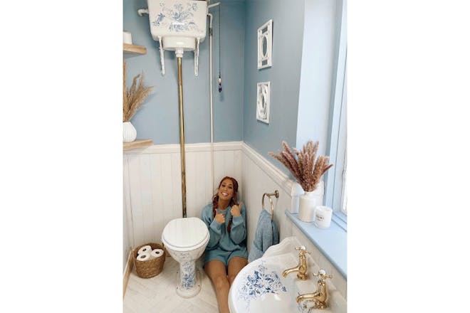 Stacey Solomon poses in her blue loo