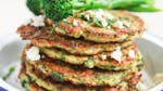 Stack of couscous pancakes with feta cheese and Tenderstem broccoli