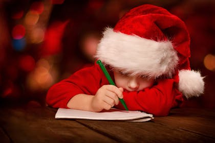 A kid writing a letter to Santa