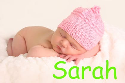Baby girl sleeping with the name Sarah in text